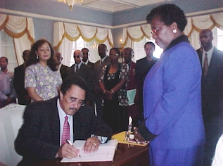 Dr. Anthony signing after the Oath of Office