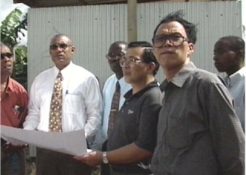 Minister Greaves and Chinese Officials Study the site for the New Mental Hospital