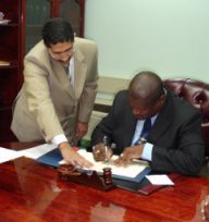 Prime Minister King signing loan agreement